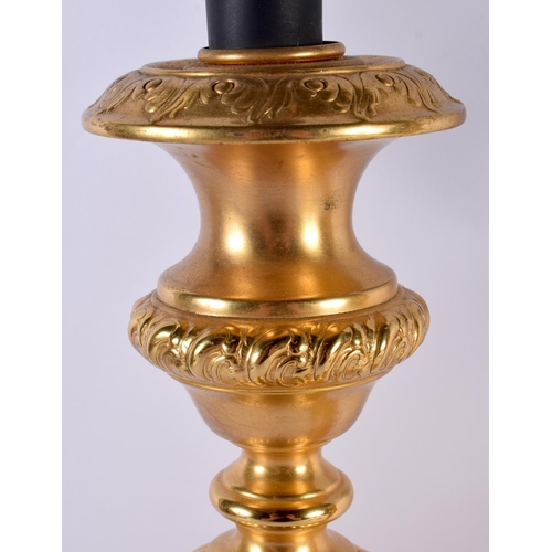 488 - A LARGE PAIR OF CONTINENTAL GILT METAL CANDLESTICKS. 66 cm long.