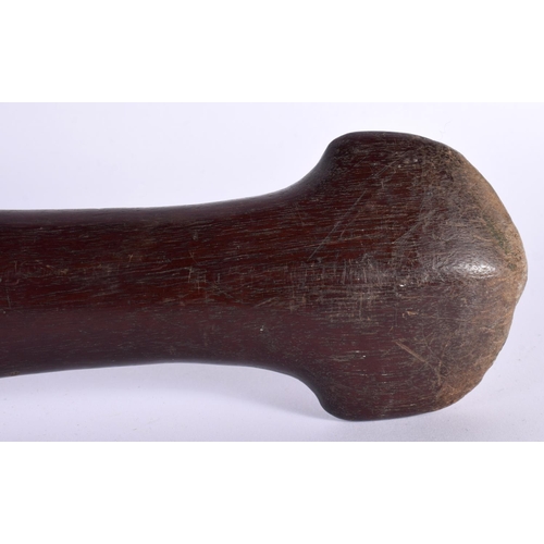 490 - AN ANTIQUE POLYNESIAN TRIBAL CARVED WOOD PADDLE CLUB inscribed with motifs. 99 cm long.