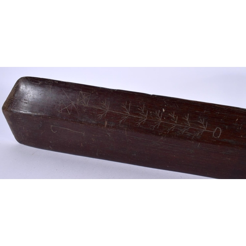 490 - AN ANTIQUE POLYNESIAN TRIBAL CARVED WOOD PADDLE CLUB inscribed with motifs. 99 cm long.