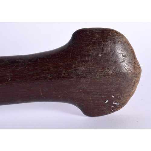 490 - AN ANTIQUE POLYNESIAN TRIBAL CARVED WOOD PADDLE CLUB inscribed with motifs. 99 cm long.