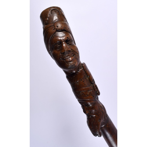 491 - AN 18TH/19TH CENTURY TURKISH OTTOMAN FIGURAL CARVED WOOD WALKING CANE. 100 cm long.