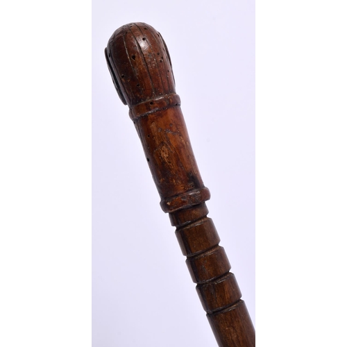 492 - AN ANTIQUE FOLK ART DOG HEAD CARVED WOOD SWAGGER STICK. 83 cm long.