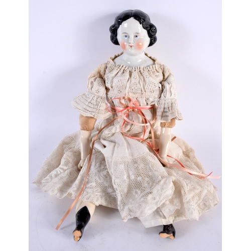 499 - AN ANTIQUE PORCELAIN HEADED DOLL with lace outfit. 38 cm long.