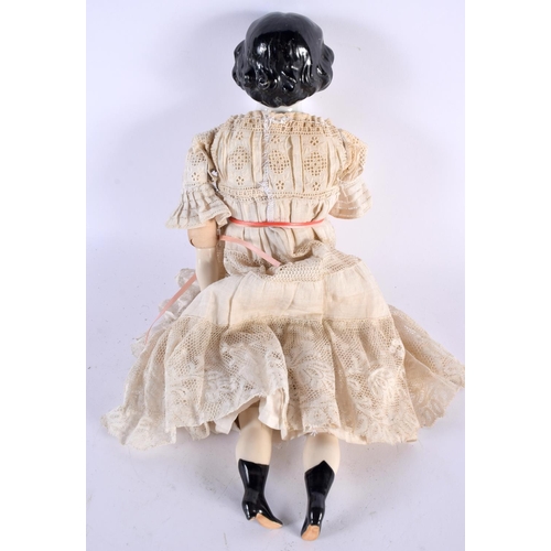 499 - AN ANTIQUE PORCELAIN HEADED DOLL with lace outfit. 38 cm long.