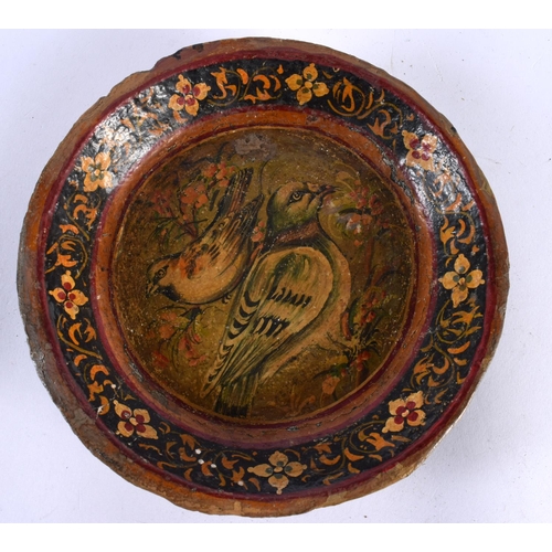 505 - AN ANTIQUE INDIAN PERSIAN MIDDLE EASTERN QAJAR LACQUERED DISH painted with birds. 18cm wide.