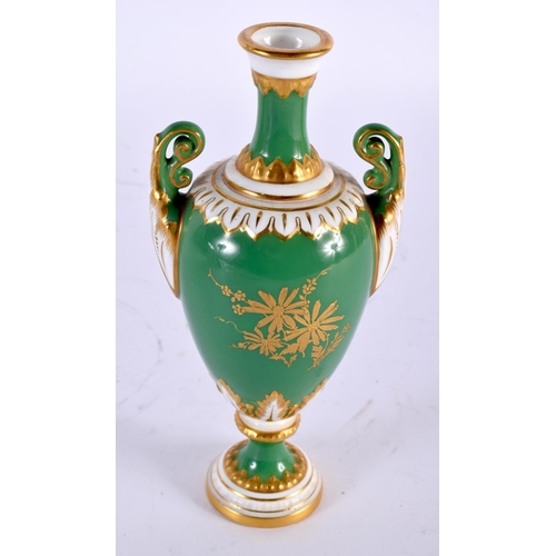 5 - A FINE ANTIQUE ROYAL WORCESTER TWIN HANDLED PORCELAIN VASE by E Phillips, painted with roses upon an... 