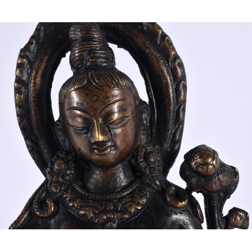 506 - A 19TH CENTURY INDIAN NEPALESE BRONZE FIGURE OF A SEATED BUDDHA modelled with one hand raised. 18cm ... 