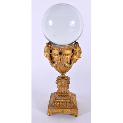 507 - A 19TH CENTURY FRENCH GILT BRONZE AND ROCK CRYSTAL BALL ON STAND. 22cm high.