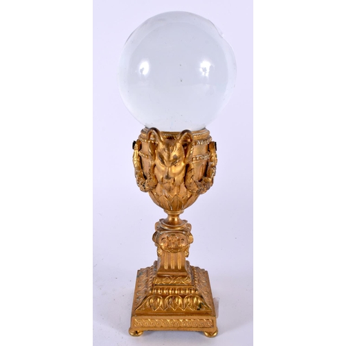 507 - A 19TH CENTURY FRENCH GILT BRONZE AND ROCK CRYSTAL BALL ON STAND. 22cm high.