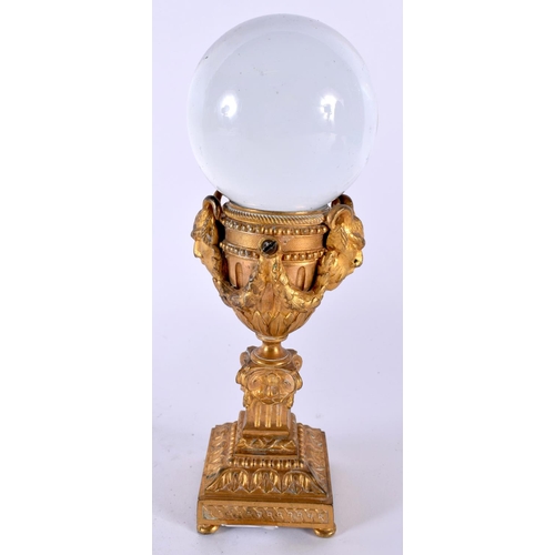 507 - A 19TH CENTURY FRENCH GILT BRONZE AND ROCK CRYSTAL BALL ON STAND. 22cm high.