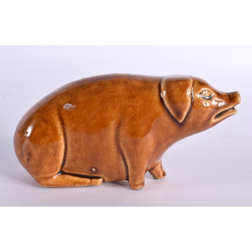 51 - A SMALL TREACLE GLAZED PIG POTTERY MONEY BOX. 13 cm x 8 cm.