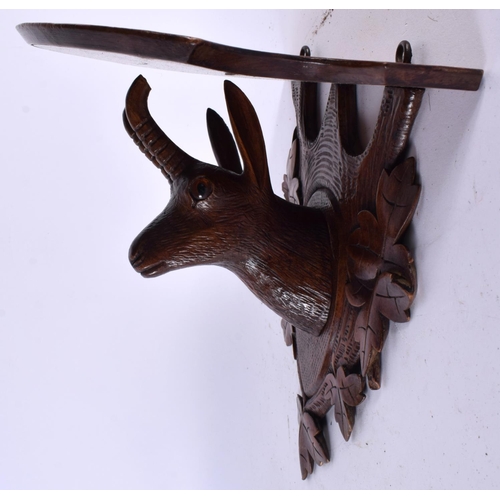 518 - A LATE 19TH CENTURY BAVARIAN BLACK FOREST CARVED DEER WALL BRACKET. 25 cm x 15cm.