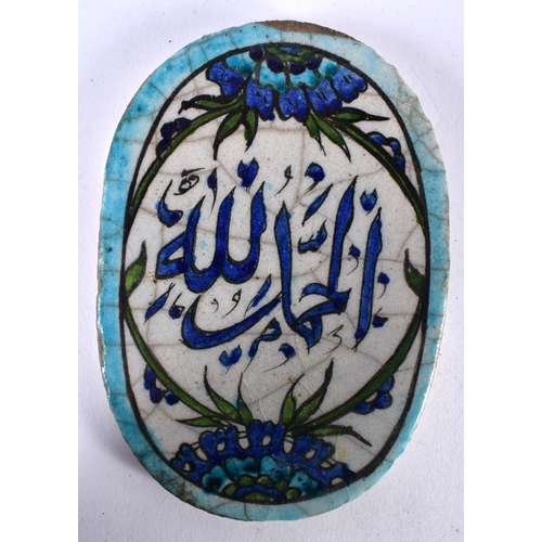 522 - A MIDDLE EASTERN FAIENCE ISLAMIC CALLIGRAPHY PANEL. 13 cm x 9 cm.