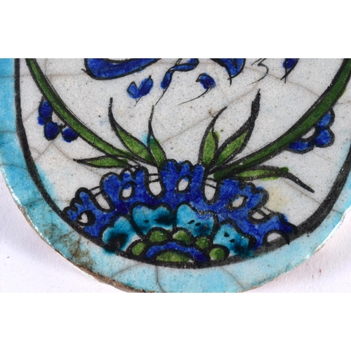 522 - A MIDDLE EASTERN FAIENCE ISLAMIC CALLIGRAPHY PANEL. 13 cm x 9 cm.