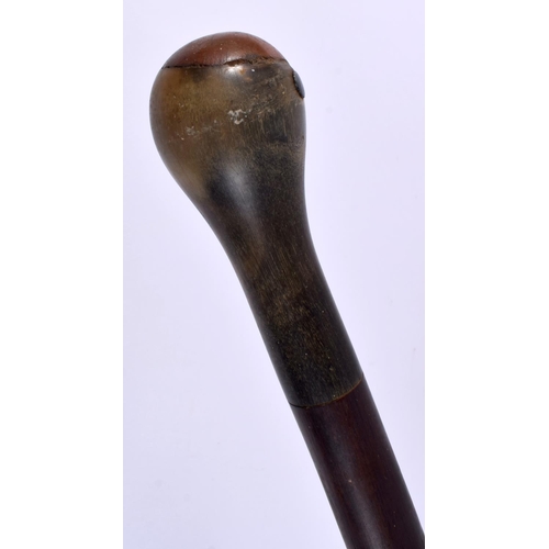 545 - A 19TH CENTURY MIDDLE EASTERN RHINOCEROS HORN HANDLED CANE. 90cm long.