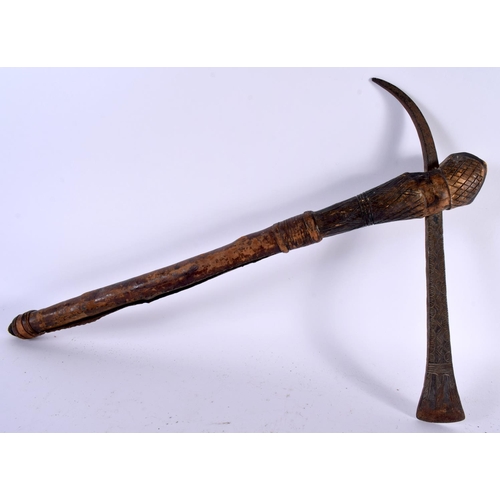 546 - AN AFRICAN TRIBAL CARVED WOOD AND IRON AXE together with two others. Largest 52 cm long. (3)