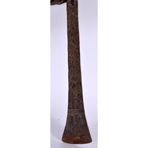 546 - AN AFRICAN TRIBAL CARVED WOOD AND IRON AXE together with two others. Largest 52 cm long. (3)