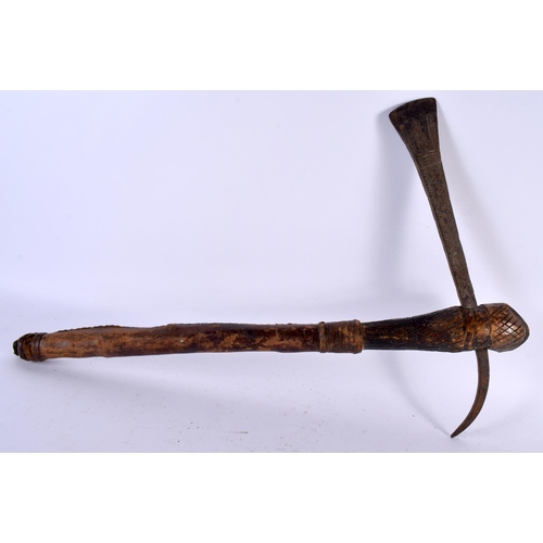 546 - AN AFRICAN TRIBAL CARVED WOOD AND IRON AXE together with two others. Largest 52 cm long. (3)