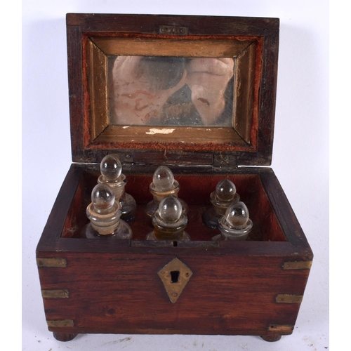 556 - AN ANTIQUE ANGLO INDIAN BRASS INLAID SCENT BOTTLE HOLDER formed as a brass inlaid box. 15cm x 10 cm.