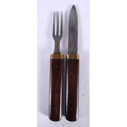 557 - A VINTAGE MILITARY CAMPAIGN KNIFE AND FORK. 19 cm long.