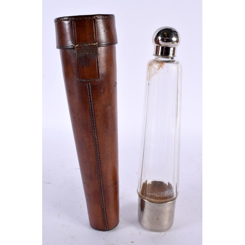 558 - AN ANTIQUE HUNTING FLASK within a leather case. 28cm long.