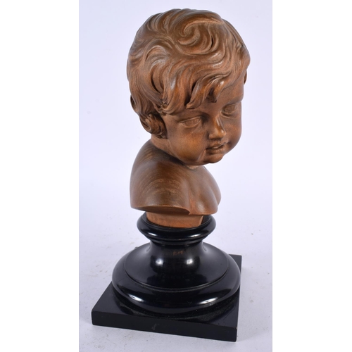 563 - A FINE EARLY 20TH CENTURY EUROPEAN CARVED TREEN BOXWOOD BUST OF A BOY modelled upon an ebonised base... 