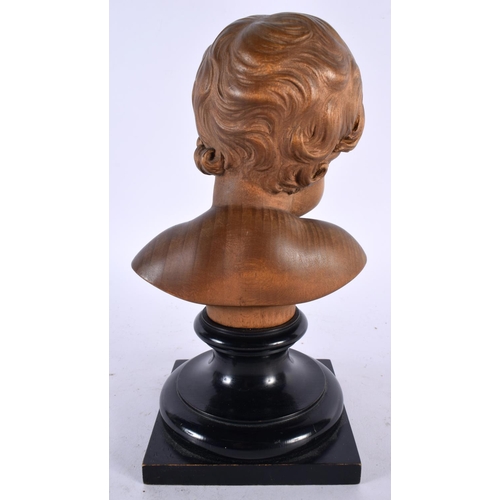 563 - A FINE EARLY 20TH CENTURY EUROPEAN CARVED TREEN BOXWOOD BUST OF A BOY modelled upon an ebonised base... 