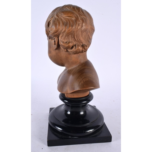 563 - A FINE EARLY 20TH CENTURY EUROPEAN CARVED TREEN BOXWOOD BUST OF A BOY modelled upon an ebonised base... 