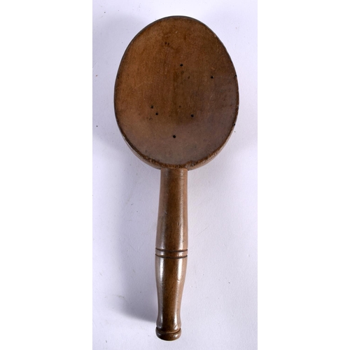 566 - A TREEN BUTTER BOWL with spoon. Largest 27 cm diameter. (2)