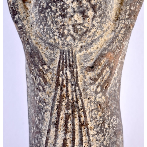 576 - AN EGYPTIAN POTTERY USHABTI. 18cm high.