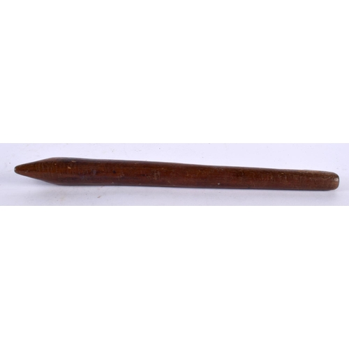 577 - AN ANTIQUE TRIBAL CARVED WOOD ARROW FORM TOOL possibly a whistle. 27 cm long.