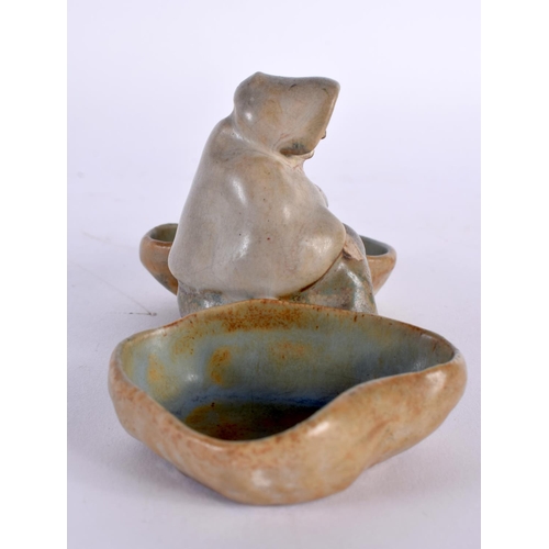 58 - A SMALL STUDIO POTTERY FIGURAL DOUBLE SALT. 14cm wide.