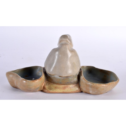 58 - A SMALL STUDIO POTTERY FIGURAL DOUBLE SALT. 14cm wide.