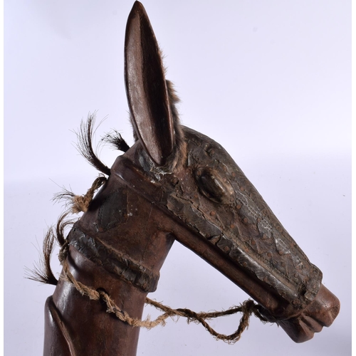 581 - AN UNUSUAL EARLY 20TH CENTURY CARVED CONTINENTAL HORSE STICK possibly a toy. 85 cm long.