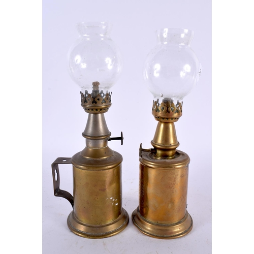 587 - TWO BRASS PIGEON LAMPS. 23 cm high.