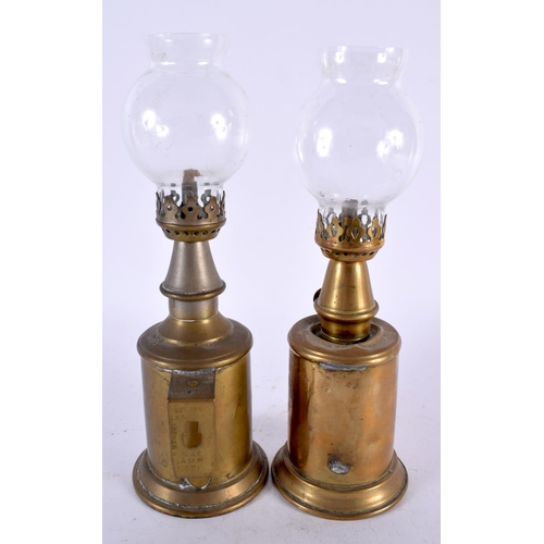 587 - TWO BRASS PIGEON LAMPS. 23 cm high.