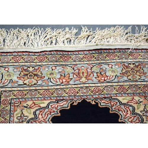 592 - A KAYSER SILK PRAYER RUG. 100 cm x 50 cm.