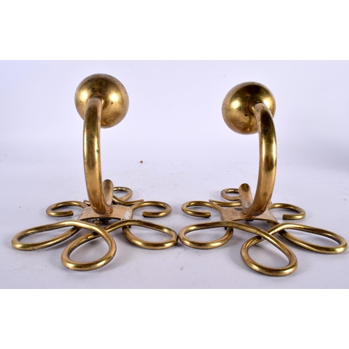 593 - A PAIR OF VINTAGE BRASS WALL APPLIQUES. 15cm x 10 cm.