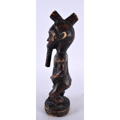 595 - AN AFRICAN TRIBAL WOOD FIGURE. 24 cm high.