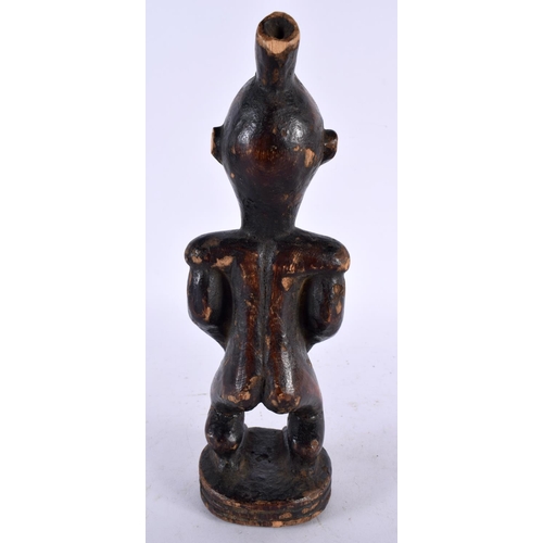 595 - AN AFRICAN TRIBAL WOOD FIGURE. 24 cm high.