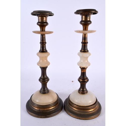 596 - A PAIR OF ANTIQUE ALABASTER AND BRASS CANDLESTICKS. 28cm high.