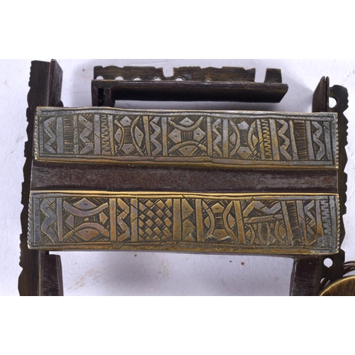 597 - FIVE ANTIQUE MIDDLE EASTERN LOCKS. Largest 15cm long. (3)