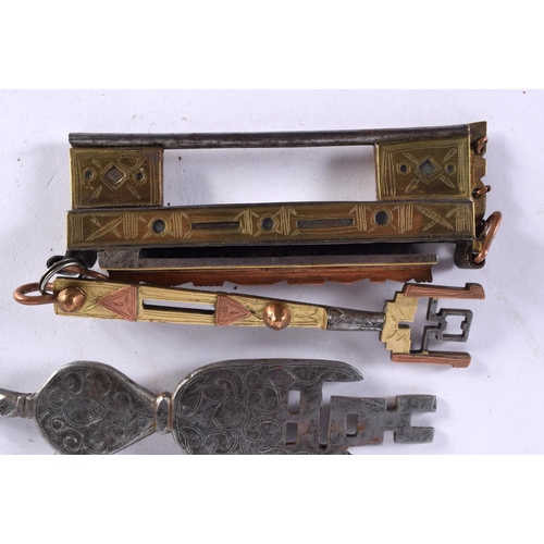 597 - FIVE ANTIQUE MIDDLE EASTERN LOCKS. Largest 15cm long. (3)