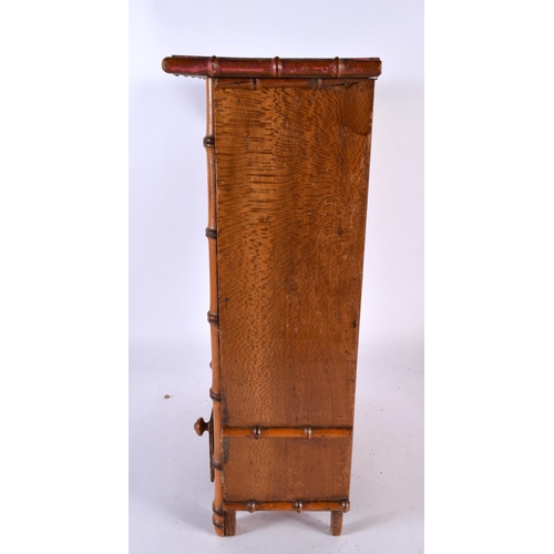 601 - AN ARTS AND CRAFTS FAUX BAMBOO APPRENTICE MADE WARDROBE. 42 cm x 27 cm.