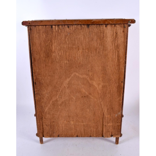 601 - AN ARTS AND CRAFTS FAUX BAMBOO APPRENTICE MADE WARDROBE. 42 cm x 27 cm.