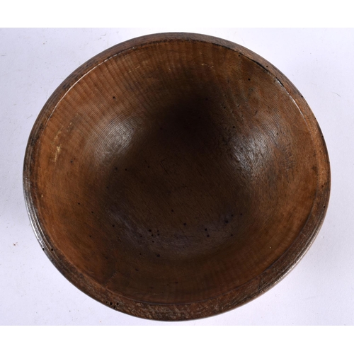 603 - AN ANTIQUE TREEN BUTTER BOWL. 15cm diameter.