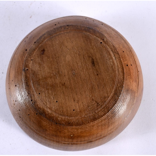 603 - AN ANTIQUE TREEN BUTTER BOWL. 15cm diameter.