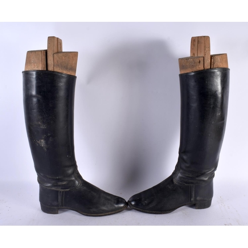 614 - A PAIR OF LEATHER HORSE RIDING SHOES with trees. 46 cm high.