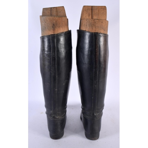 614 - A PAIR OF LEATHER HORSE RIDING SHOES with trees. 46 cm high.