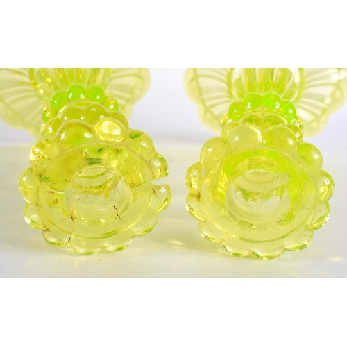 63 - A PAIR OF ART DECO URANIUM GLASS CANDLESTICKS. 24 cm high.